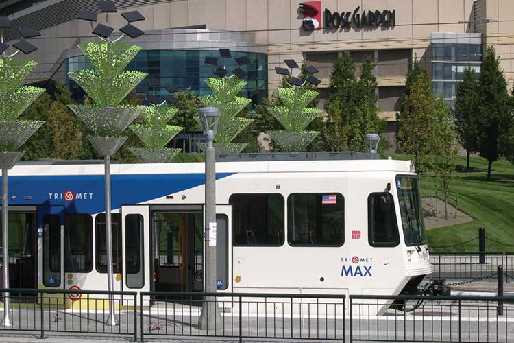 Interstate MAX Yellow Line approaching the Rose Garden Arena and Rose Quarter Transit Center